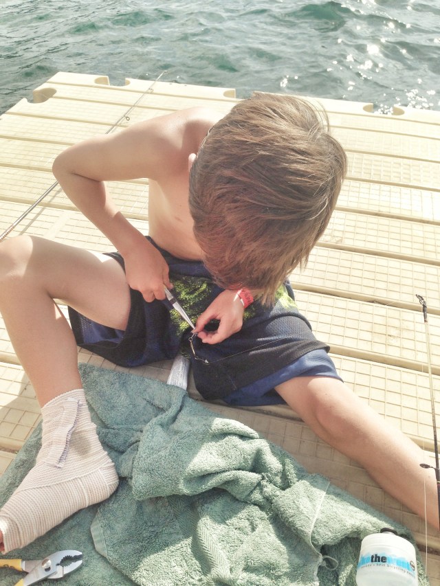 Stephen pulling a hook out of his shorts